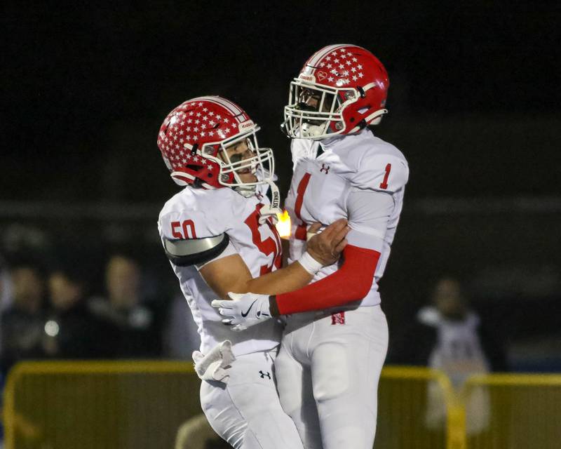 Naperville Central's DeShaun Williams (1) celebrates a touchdown reception during Class 8A quarterfinal football game between Naperville Central at Lyons on Friday, Nov 15, 2024  in Western Springs.