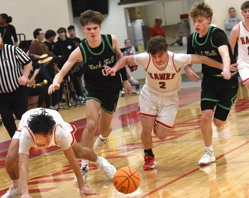 Oregon's Benny Olalde (1) and Cooper Johnson (2) battle Rock Falls' Max Burns (0) and Owen Mandrell (24) for a loose ball on Friday, Jan. 9, 2026 at the Blackhawk Center in Oregon.