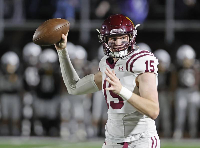 Loyola's Ryan Fitzgerald (15) prepares to pass during the varsity football game between Loyola Academy and Mt. Carmel high school on Friday, Oct. 25, 2024 in Chicago.