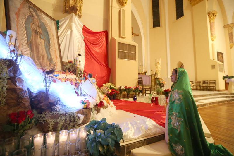 Yetzly Mondragen of La Salle, prays during the Our Lady of Guadalupe festival and Mass on Thursday, Dec. 12, 2024 at St. Hyacinth Church in La Salle.