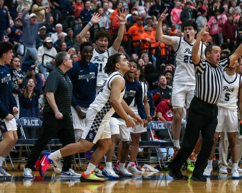 Oswego East's Alton Bullock (32) watches his game tying three pointer to force overtime during their basketball game between Oswego at Oswego East, Feb 13, 2026 in Oswego.