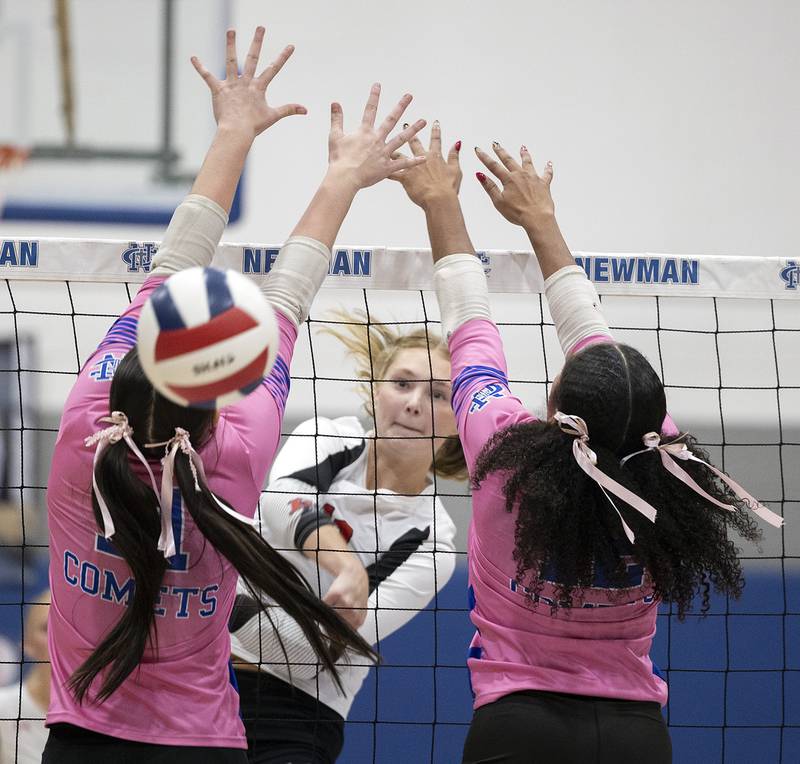 Erie-Prophetstown’s Lauren Abbott hammers a spike past the Newman defense Tuesday, Oct. 14, 2025.