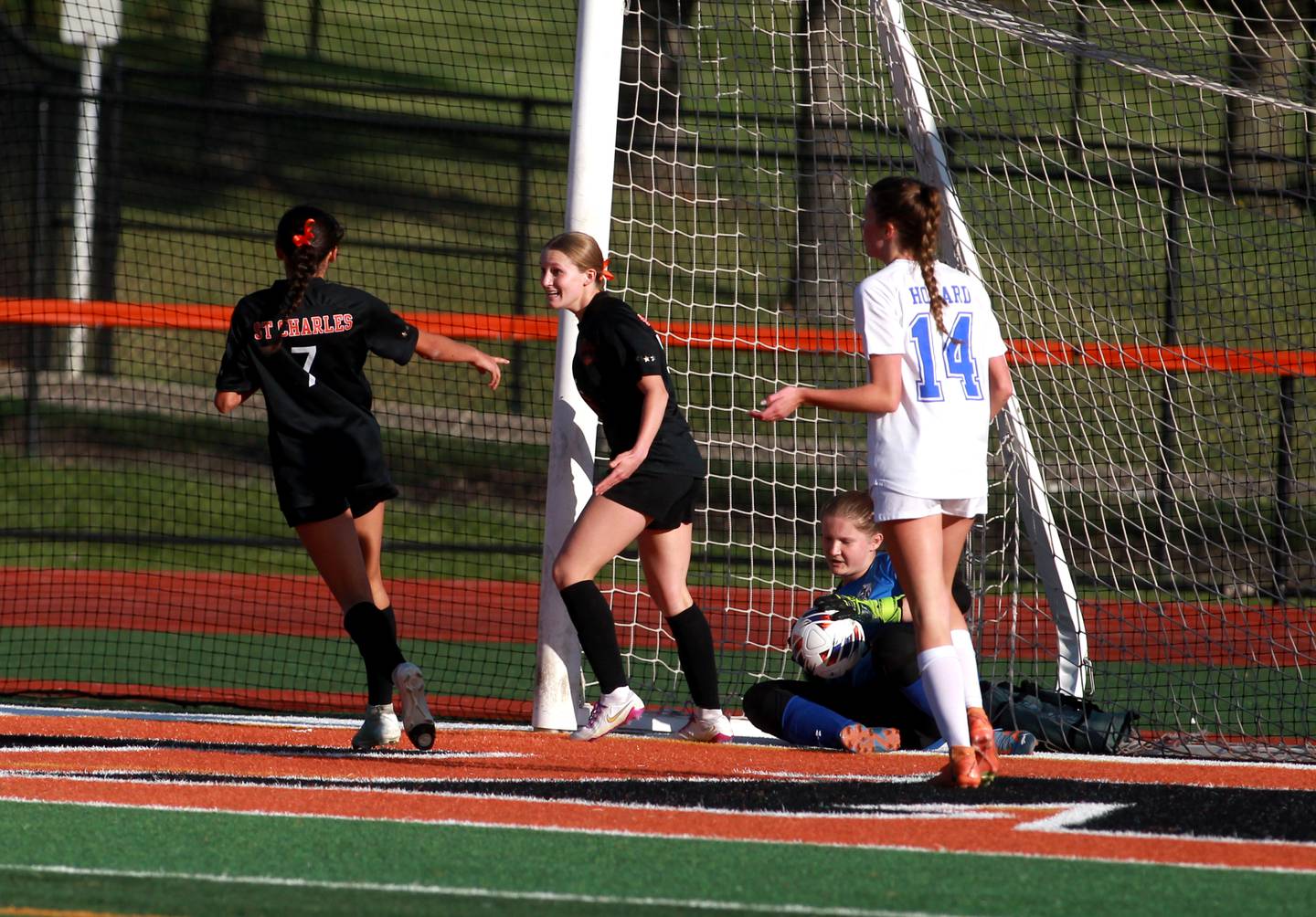 St. Charles East's Anika Dodrill (center) celebrates her goal with teammate Mya Leon (left) during the Class 3A St. Charles East Regional final against Geneva on Friday, May 23, 2025 in St. Charles.