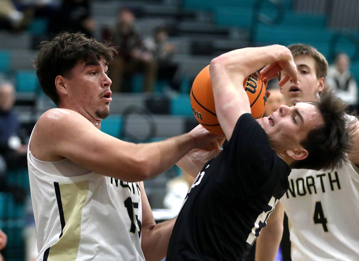 Grayslake North's Uros Mitrovic battles with Prairie Ridge's Brendan Beu for the basketball during the 2025 Hoops for Healing tournament basketball game on Wednesday, Nov. 26, 2025, at Woodstock North High School.