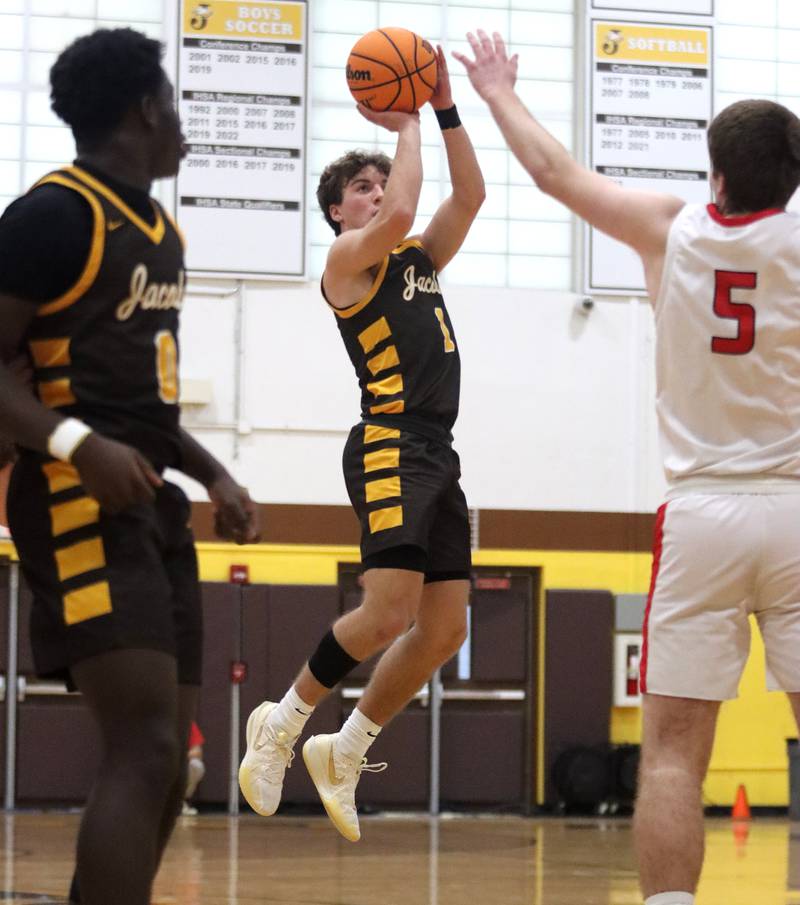 Jacobs’ Ben Jurzak takes an outside shot against Barrington during Hinkle Holiday Classic varsity boys basketball tournament action on Monday, Dec. 23, 2024 at Jacobs High School in Algonquin.