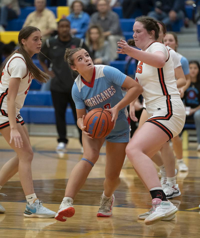 Marian Central's Adriana Wrzos looks to make a shot as she is defended by Crystal Lake Central's Leah Spychala, right, during their game at the Johnsburg High School Varisty Feast Mode Holiday Girls Basketball Tournament on Tuesday, November 19, 2024 in Johnsburg. Ryan Rayburn for Shaw Local