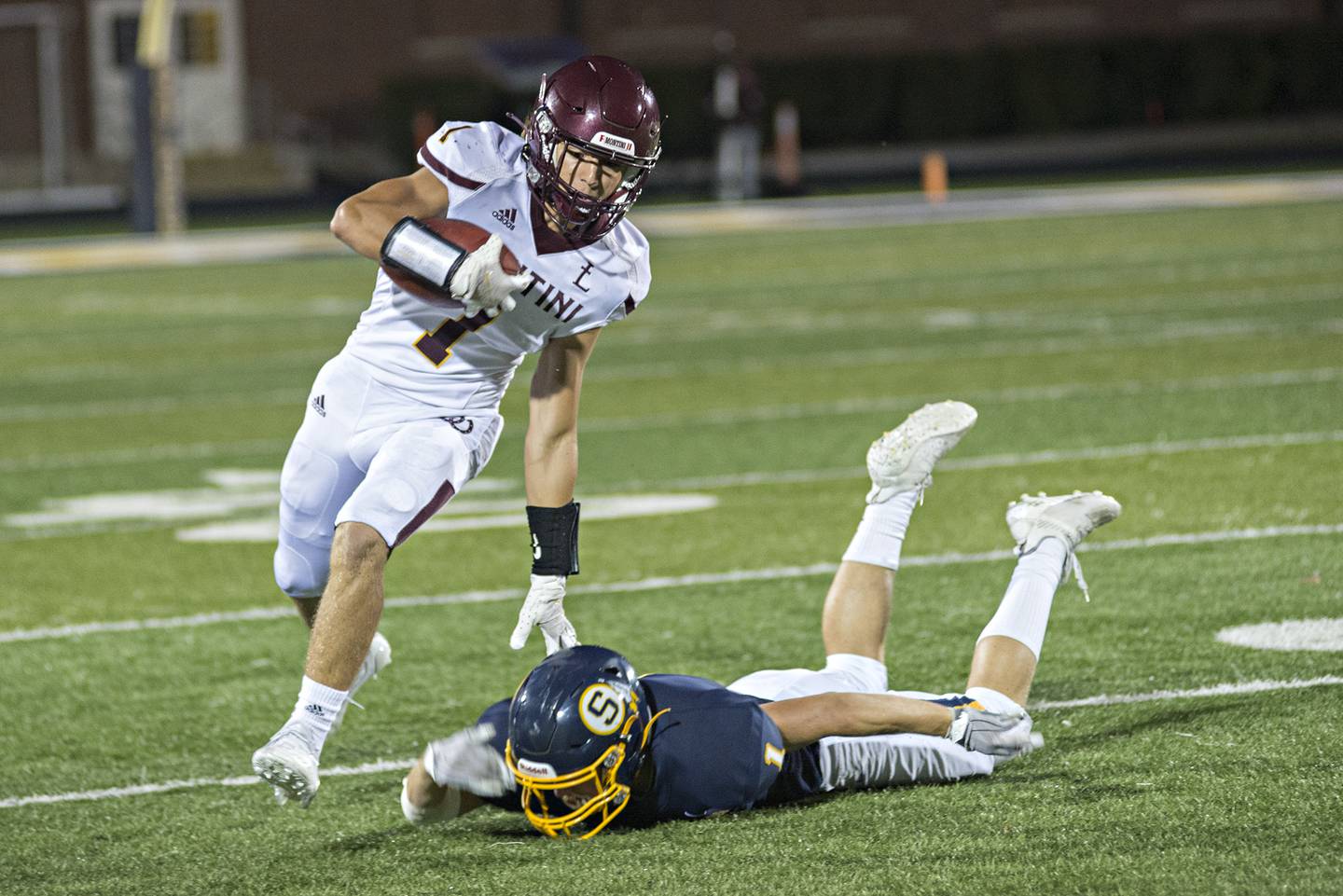 Montini's Mario Florio avoids a tackle by Sterling's Tommy Tate Friday, September 3, 2021.