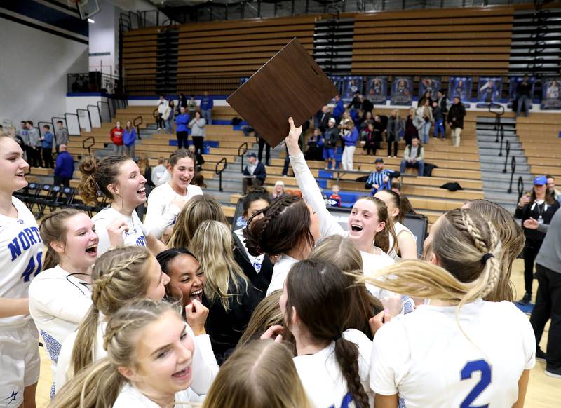 St. Charles North players celebrate their Class 4A St. Charles North Regional final win over Wheaton North on Thursday, Feb. 16, 2023.