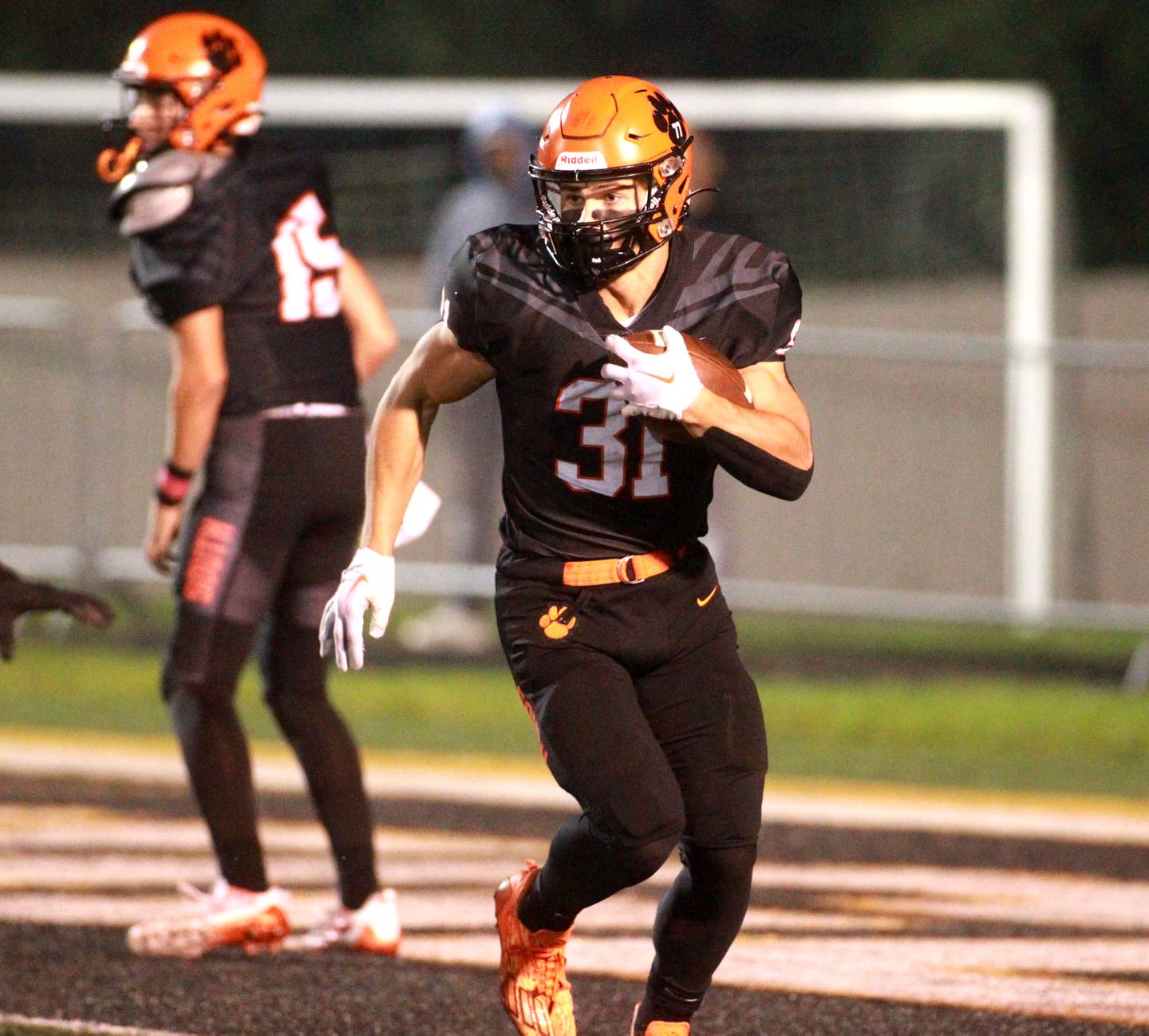 Wheaton Warrenville South’s Matthew Crider carries the ball during a game against Batavia in Wheaton on Friday, Oct. 13, 2023.