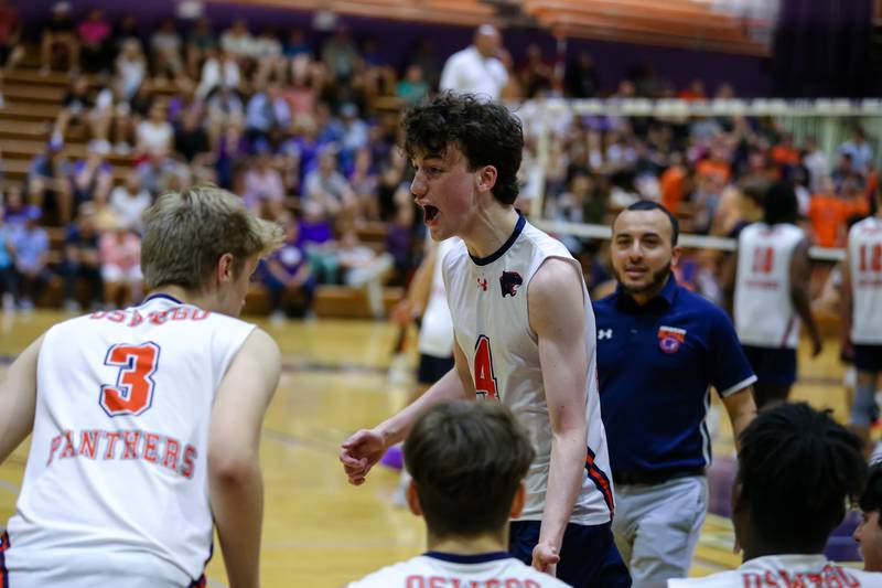 Oswego's Michael Pettke (4) pumps up teammates after scoring a point during Downers Grove North Regional final match between Oswego at Downers Grove North. May26, 2022.