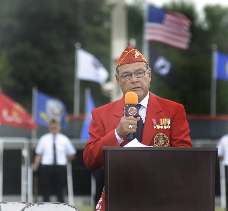 La Salle County States Attorney Joe Navarro speaks to the crowd Saturday, Aug. 26, 2023, at Veterans Memorial Park in Peru during a ceremony honoring those who died in the Vietnam conflict. The Vietnam Traveling Memorial Wall was set up in Peru over the weekend.