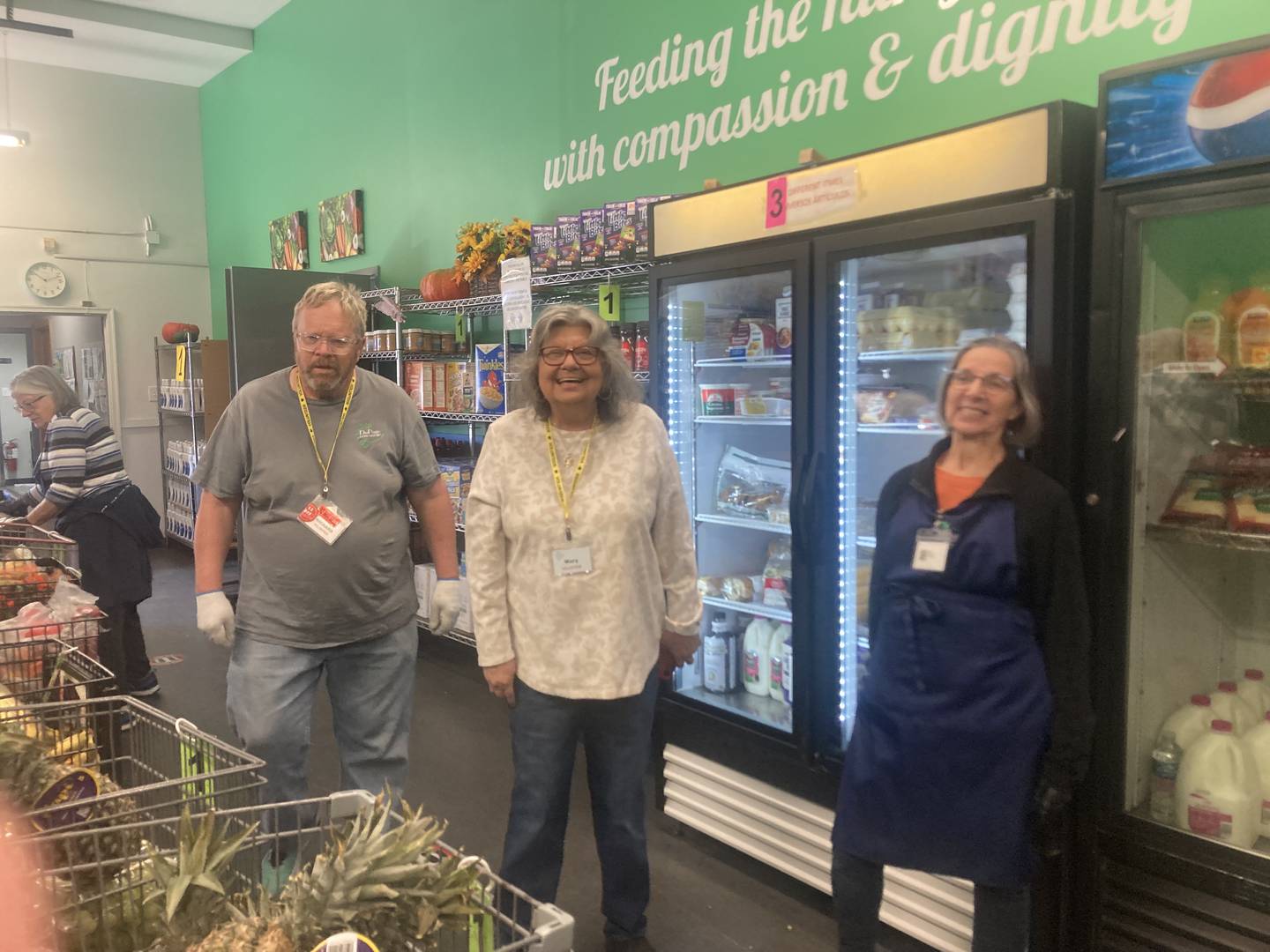 Volunteers at the DuPage Township Food Pantry prepare to help customers.
Friday, Oct. 30, 2025.
