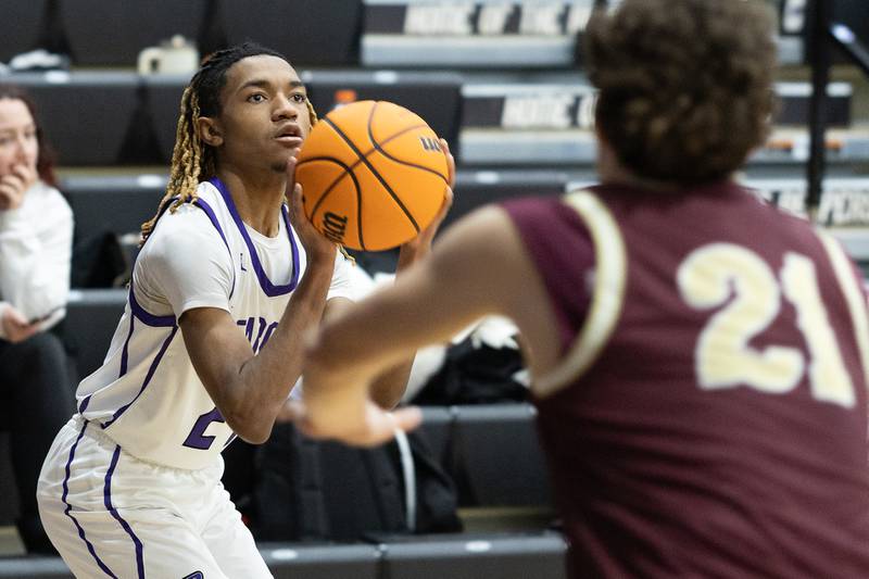 Plano's Taron McGowan (24) eyes the basket during Friday's game with Morris in Plano.