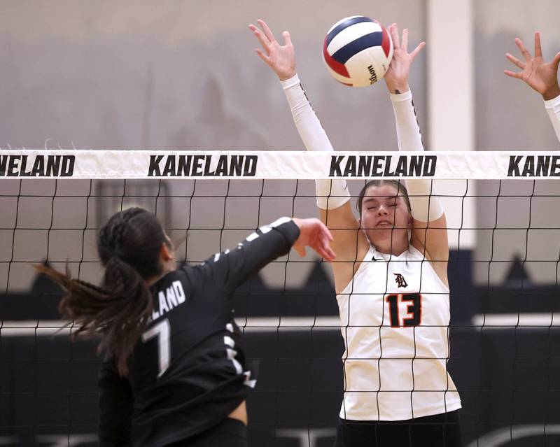 DeKalb's Camryn Hilliard blocks the spike of Kaneland's Brielle Gadomski Thursday, Sept. 4, 2025, during their match at Kaneland High School in Maple Park.