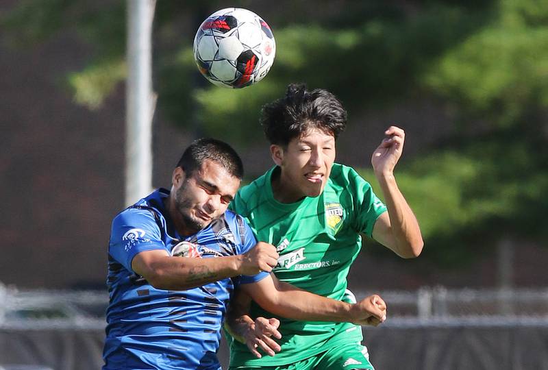DeKalb County United's Oscar Montejano (right) and Rockford FC’s Erik Manriquez go up for a header during their game Saturday, July 29, 2023, at the Soccer & Track and Field Complex at Northern Illinois University in DeKalb.