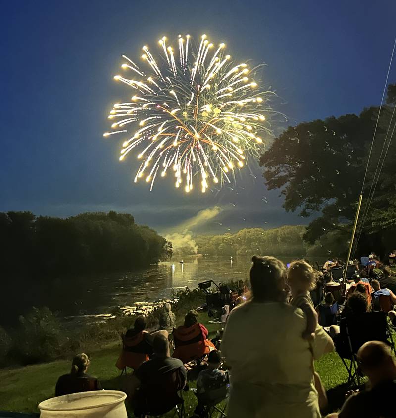 A firework reflects off the Rock River during Prophetstown's fireworks show on Saturday, July 6, 2024 at Prophetstown State Park.