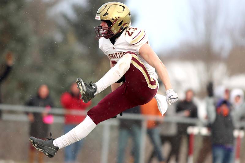 St. Ignatius’ Vinny Rugai celebrates a touchdown against Prairie Ridge in Class 6A football playoff semifinal action at Crystal Lake on Saturday.