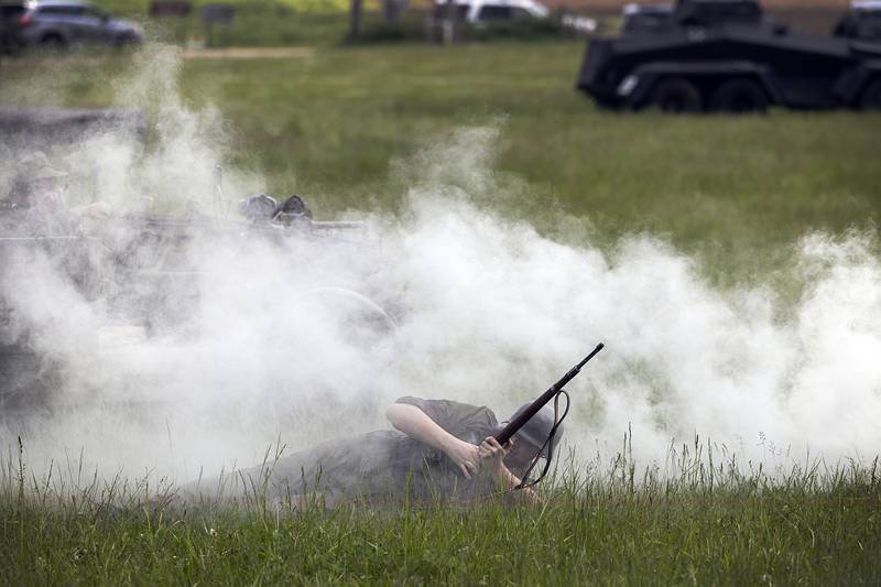 Smoke is used to cover troop movements Saturday, May 16, 2026, during a reenactment of the Battle of Anzio in Franklin Grove.
