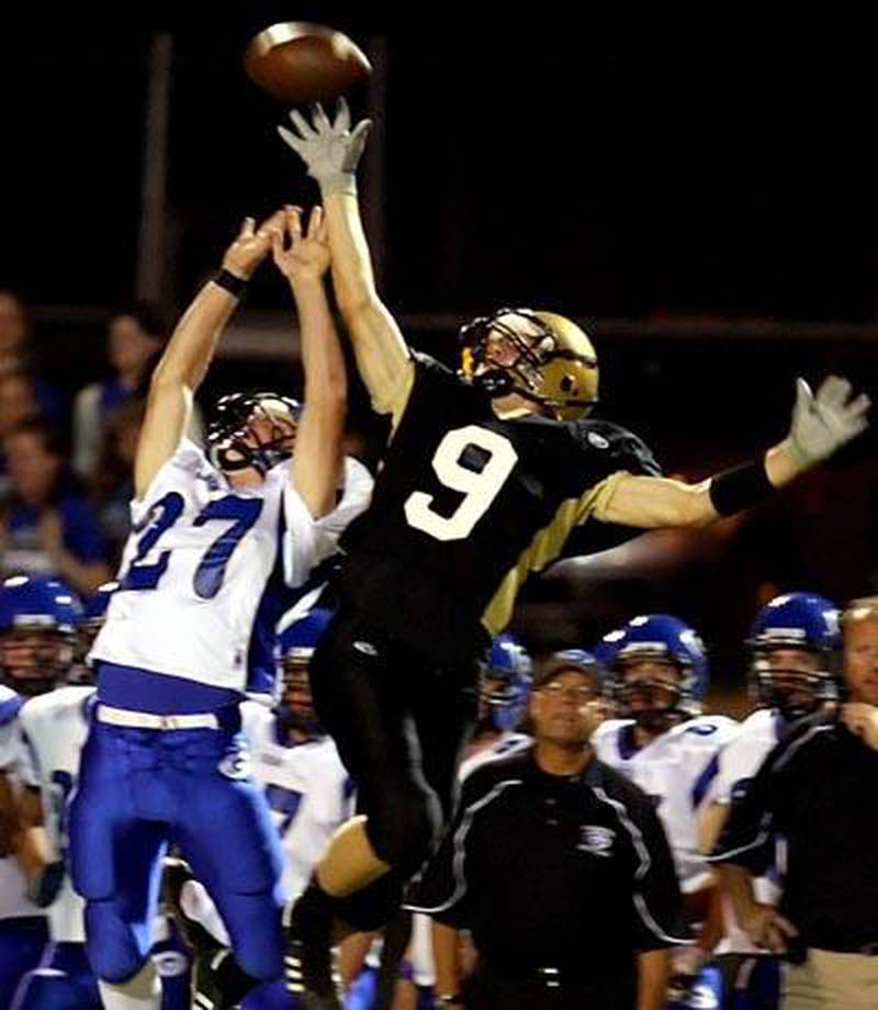 Geneva’s Phillip Birschbach (left) leaps to break up a pass intended for Sycamore wide receiver Josh Howells in the second quarter of Friday night’s game at Sycamore. The Spartans suffered a 37-14 loss to the Vikings to fall to 2-3 on the season and 1-2 in the Western Sun Conference. Sycamore heads to Rochelle next week for another Western Sun showdown. Chronicle photo ERIC SUMBERG