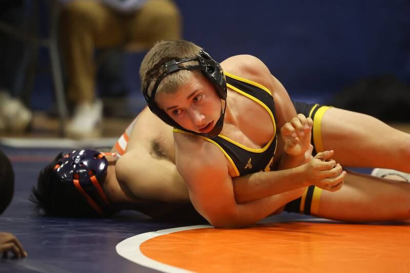 Joliet West’s Coehn Weber looks to pin Romeoville’s Alex Banena in a dual meet on Thursday, Dec.14th, 2023 in Romeoville.