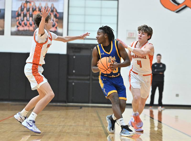Joliet Central's James Lee (10) looks to pass the ball during the 4A Lockport Regional game against Lincoln-Way West on Monday, FEB. 23, 2026, at New Lenox.