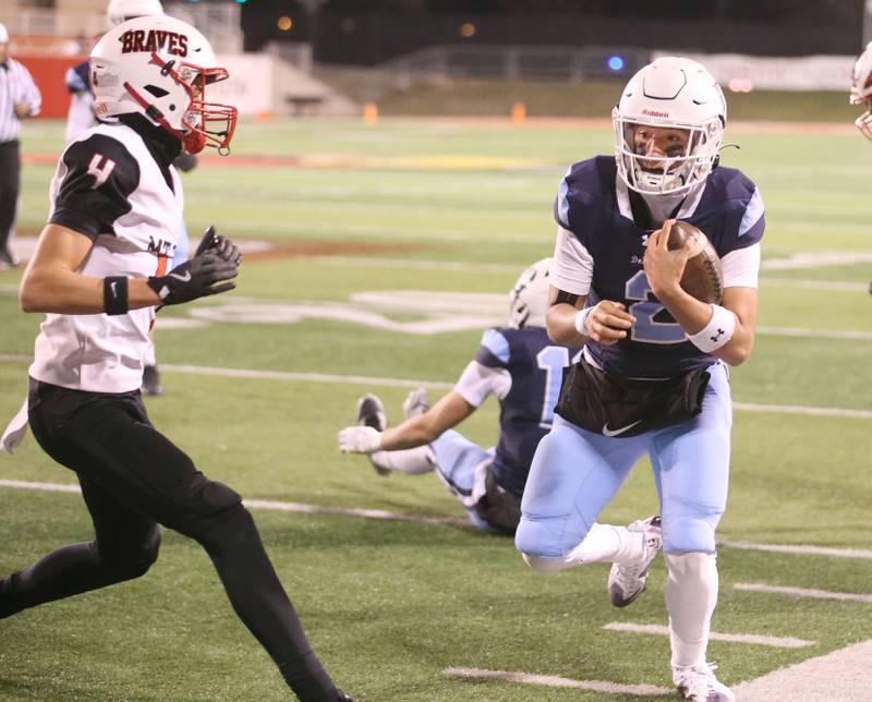 DePaul quarterback Juju Rodriguez runs the ball as Mt. Zion's Justin Ginger forces him out of bounce during the Class 4A State football championship on Friday, Nov. 29, 2024 at Hancock Stadium in Normal.