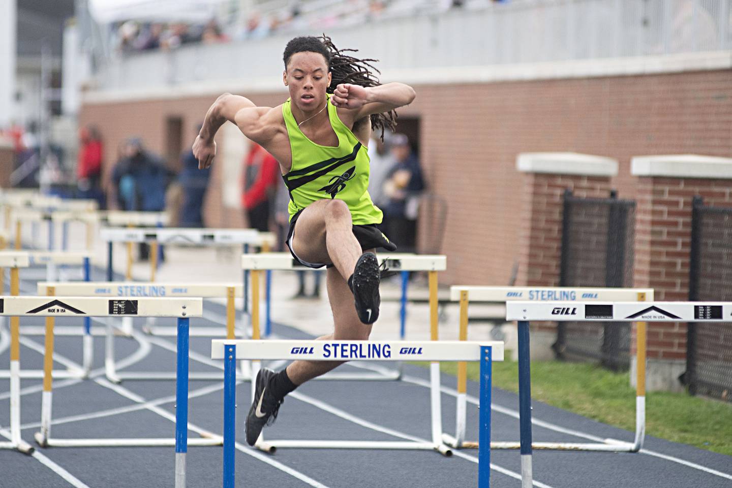 Rock Falls' Booker Cross clears a hurdle in the first leg of the 4x100 hurdle shuttle Friday, April 29, 2022 at the Sterling Night Relays.