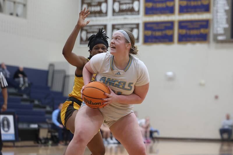 Joliet Catholic’s Emma Birsa works under the basket against Carmel on Wednesday, Jan 15, 2025 in Joliet.