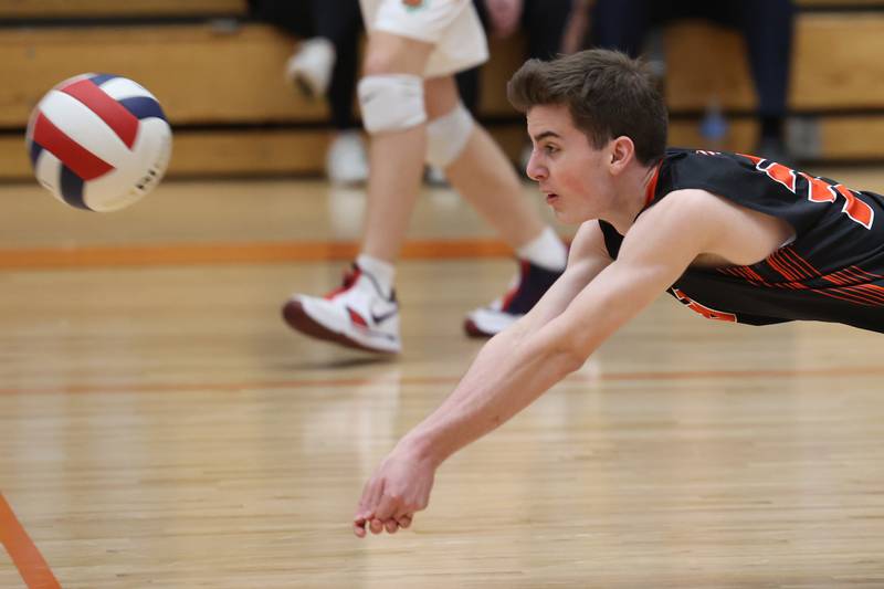 Plainfield East’s Evan Whaley dives for the dig against Lincoln-Way West on Wednesday, March 22nd. 2023 in New Lenox.
