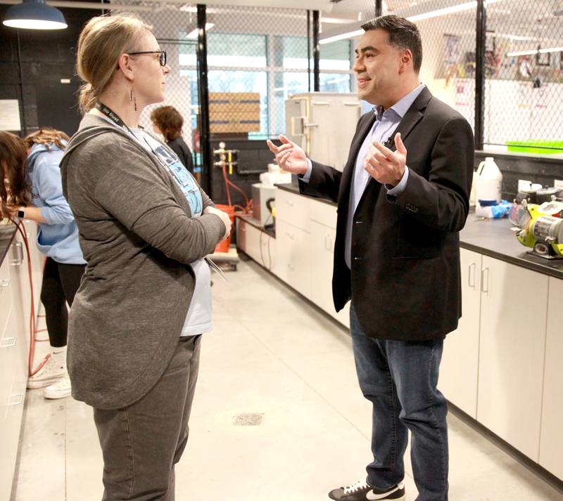Albert Ramon, chief meteorologist for CBS2 Chicago, interviews Downers Grove South art teacher Janet Taylor as part of the television station’s day-long school spotlight coverage on Friday, Feb. 23, 2024.