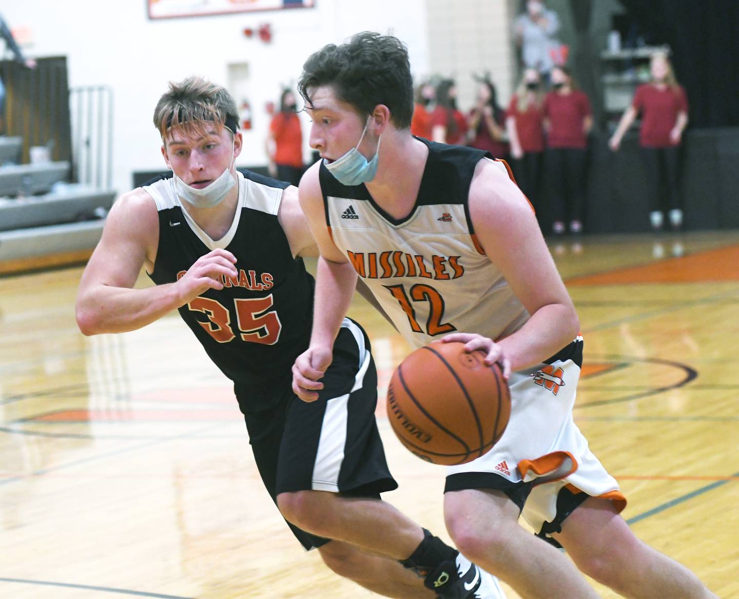 Milledgeville's Kieren Harris drives to the basket as Forreston's Joseph Synder defends during Jan. 4 action in Milledgeville.