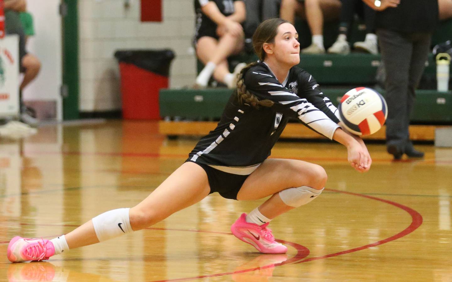 Kaneland libero Zoe Kraus digs a return from L-P on Tuesday, Oct. 7, 2025 in Sellett Gymnasium at L-P High School.