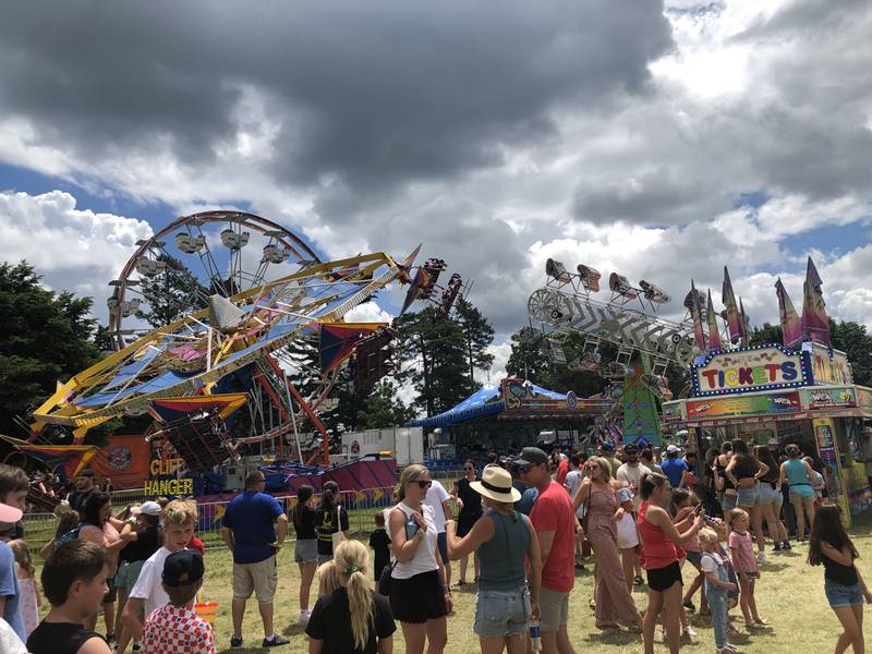 Families wait in lines for wristbands and rides shortly after noon on Saturday, July 6, 2024, at the Lakeside Festival in Crystal Lake.