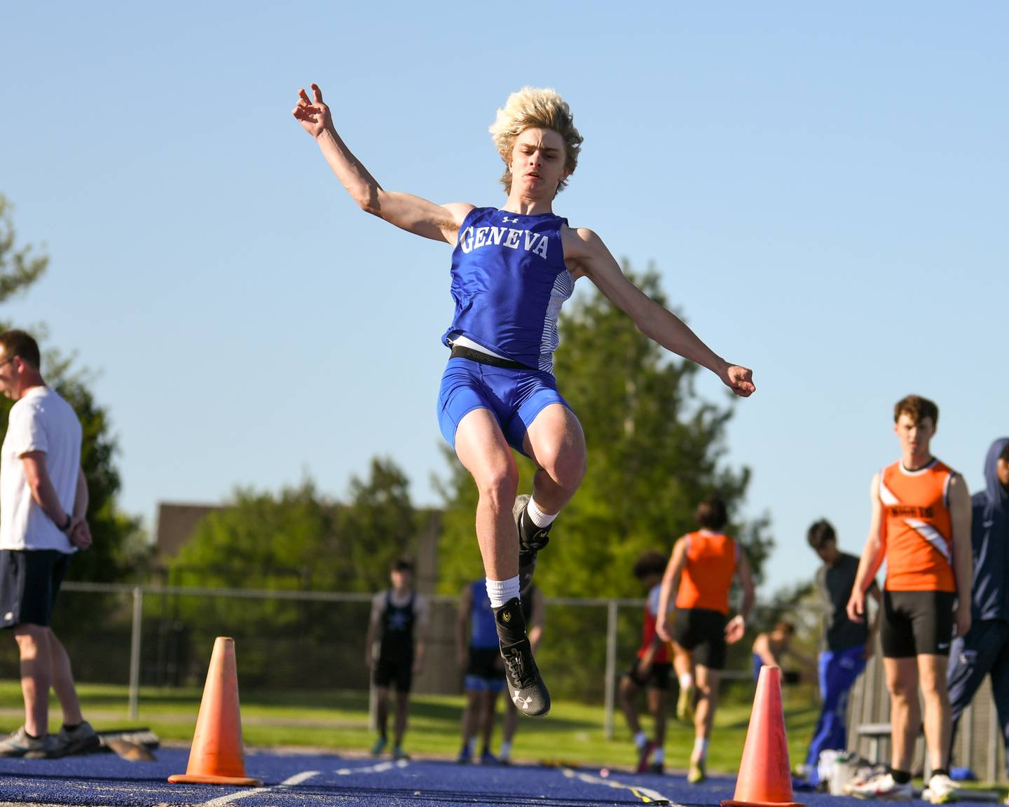 Will Pascoi of Geneva competes in the long jump during the Kane County track and field meet held at Marmion Academy in Aurora on Friday May 3, 2024.