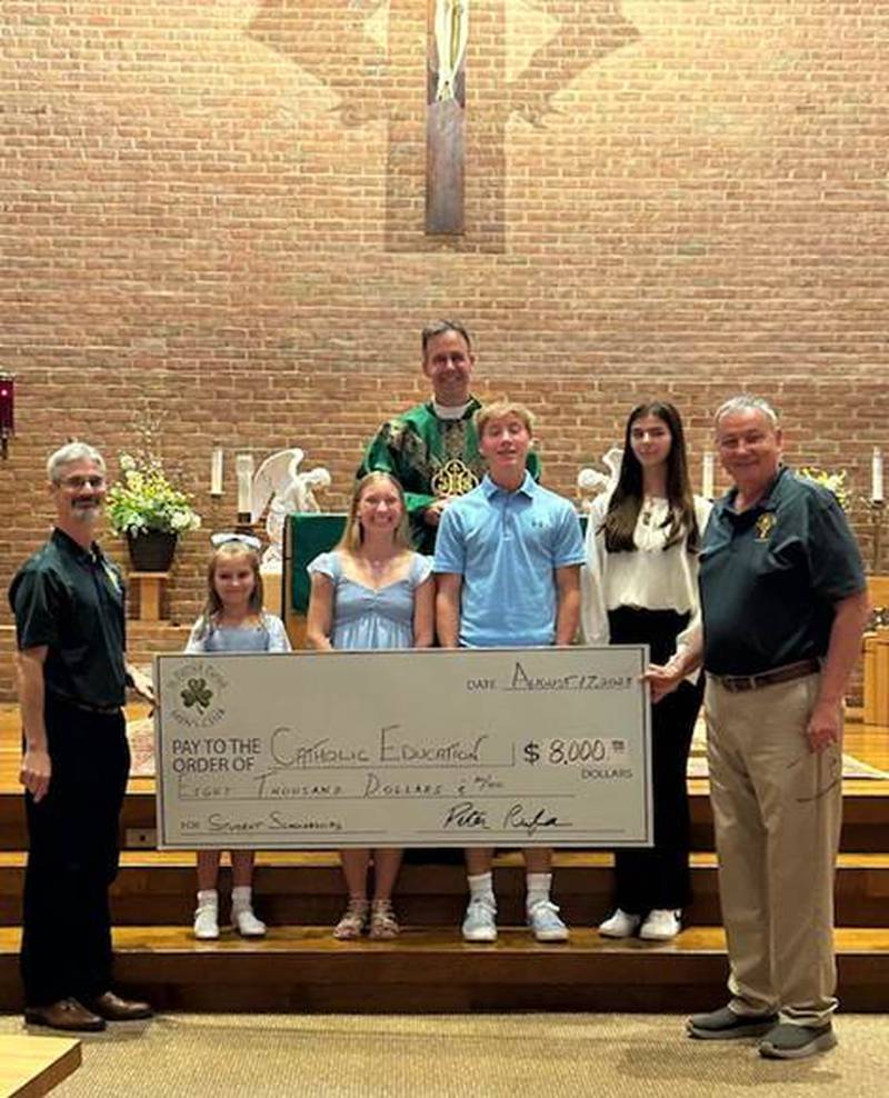 St. Patrick Men’s Club in Yorkville presented scholarships to parish families for Catholic School Education. Pictured, Peter Rufa, president of St. Patrick Men's Club, recipient Olivia Kampf, recipient Eva Rowe, Father Jim McCormack, recipient Samuel Rowe, recipient Samantha Reynolds, Mike Pfieffer, secretary and scholarship chairman of St. Patrick Men’s Club. Not pictured, recipient Caroline Kavulich.