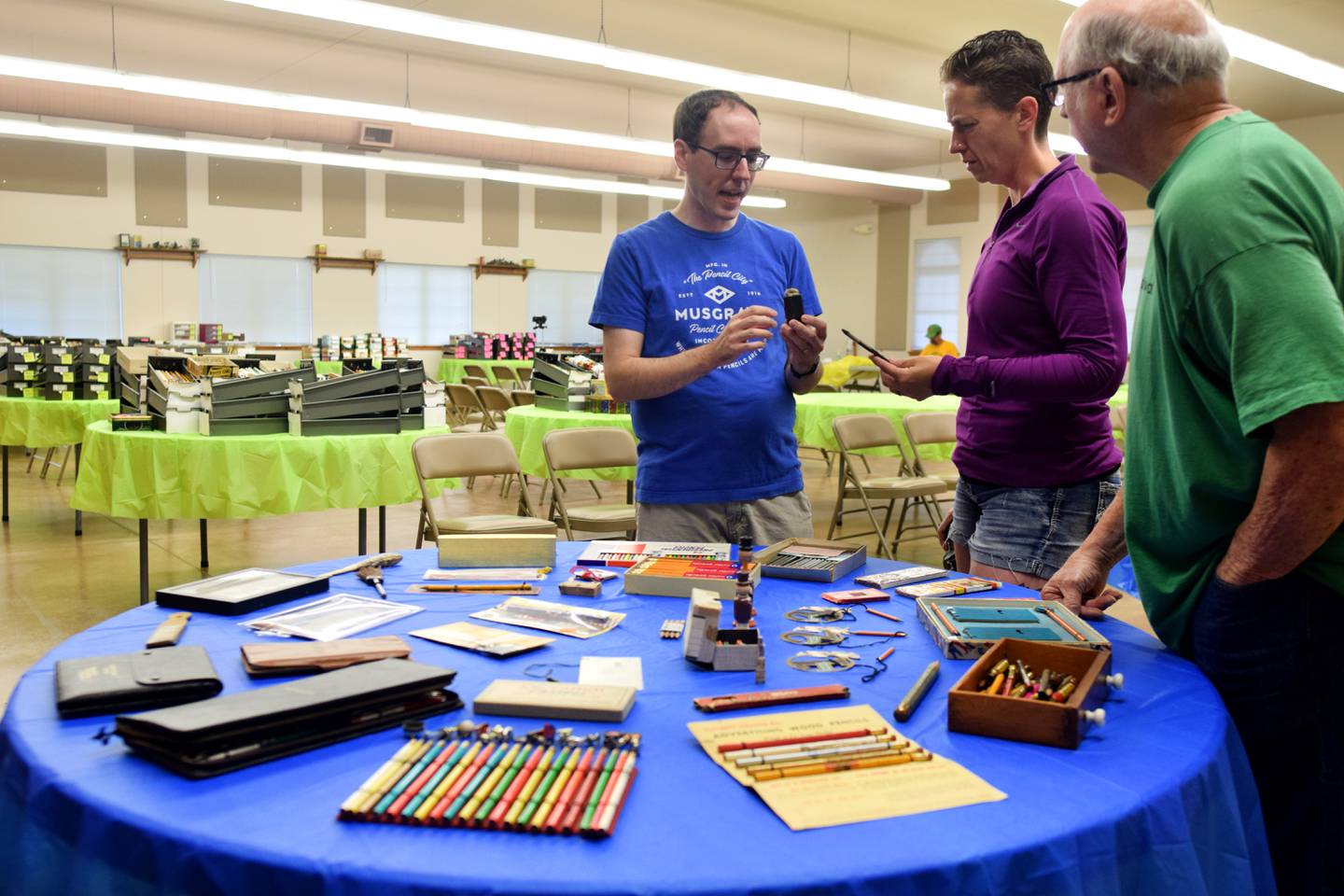 Aaron Bartholmey, 36, speaks with two visitors during a public event July 1 at Colfax Historical Society Museum & Community Center where he showed off his pencil collection and attempted to break the Guinness World Record for largest pencil collection.