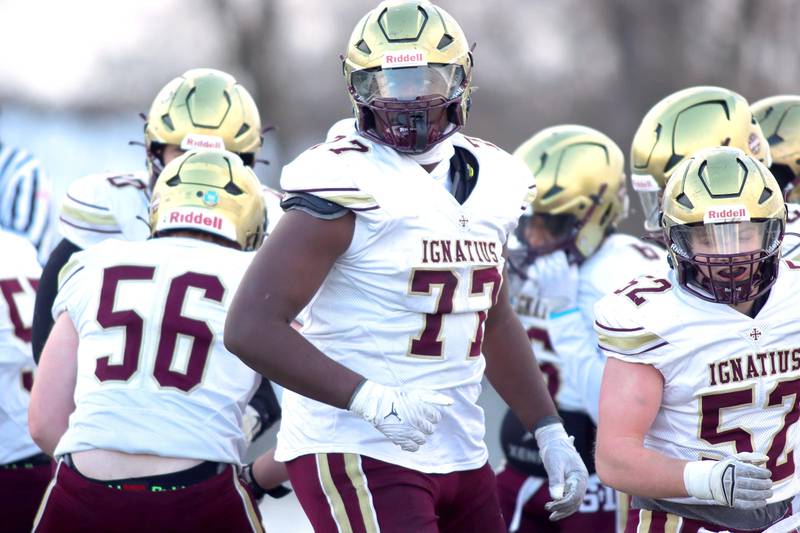 St. Ignatius’ Justin Scott prepares for a play in Class 6A football playoff semifinal action at Crystal Lake on Saturday.