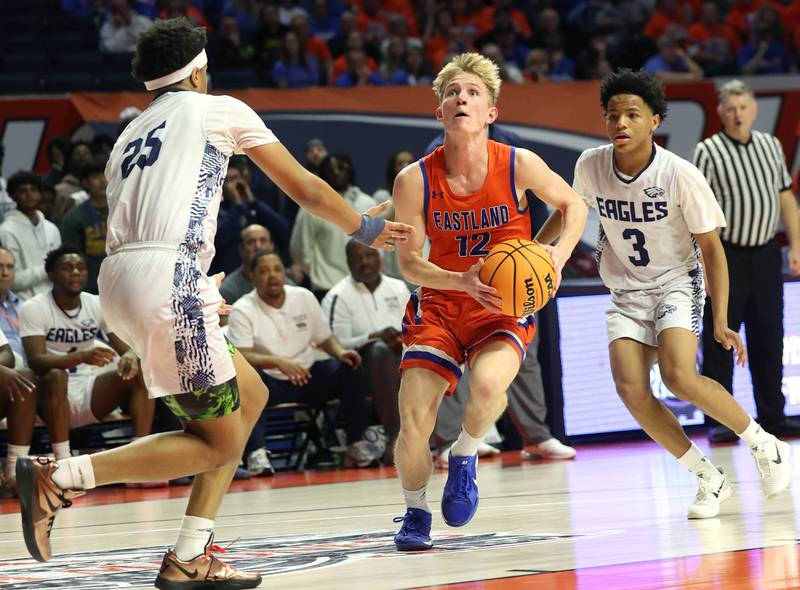 Eastland's Adam Awender drives between two Chicago Hope Academy defenders during their IHSA Class 1A state championship game Saturday, March 15, 2025, in the State Farm Center at the University of Illinois in Champaign.