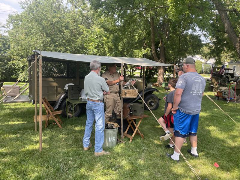 Larry Skinder greets attendees Saturday, Aug. 2, 2025, during Veterans Weekend in Genoa. He used the event to showcase the pigeon loft that he built from scratch.