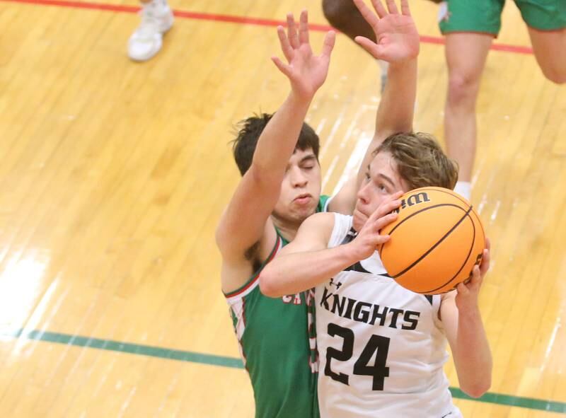 Kaneland's Luke Reinert drives to the hoop past L-P's Erick Sotelo on Friday, Jan. 31, 2025 in Sellett Gymnasium at L-P High School.
