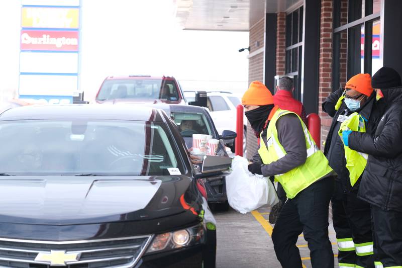 Cars quickly line up for orders at the open of the new Joliet Portillo’s location on North Larkin. Tuesday, Feb. 1, 2022 in Joliet.