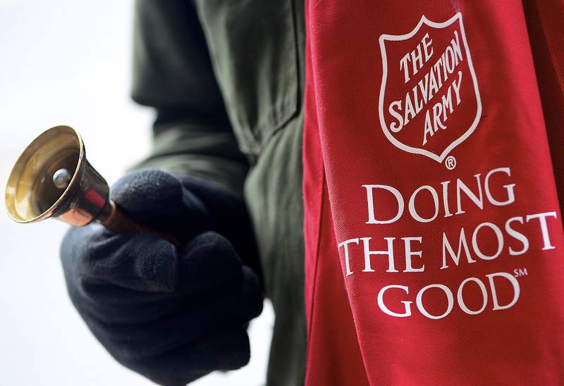 Elmer Windsor of Clear Spring, Md., rings the bell for the Salvation Army red-kettle campaign Tuesday, November 27, 2018, at the Valley Plaza shopping center in Hagerstown, Md. Windsor says he enjoys helping others and that is why he has helped out as a bell ringer for nine years.  (Colleen McGrath/The Herald-Mail via AP)
