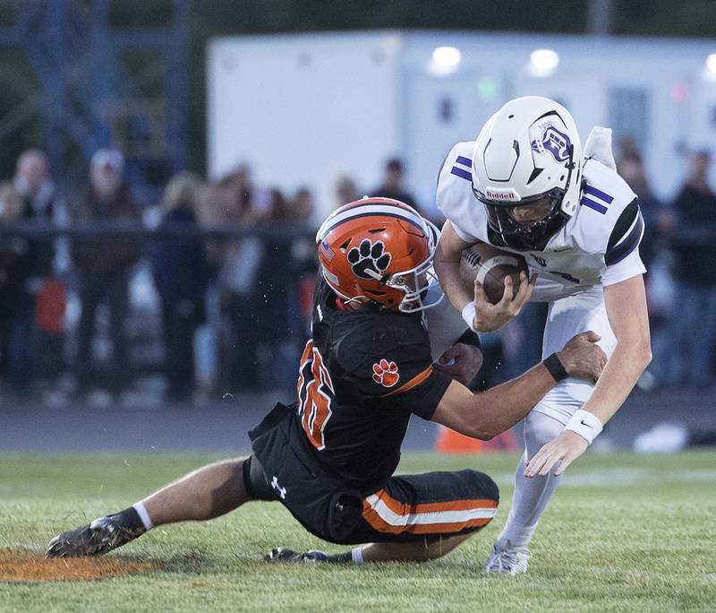 Byron’s Andrew Talbert tackles Dixon’s Jagger Kemp Friday, Sept. 5, 2025, at Byron High School.