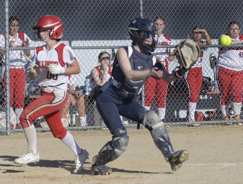 As Lisle catcher Maddie Cole awaits the thrown home, Streator’s Kieran Black crosses the plate to score Tuesday at Streator.