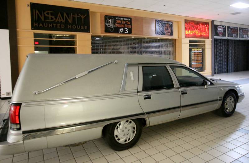 A real hearst is parked just outside the Insanity Haunted House storefront on Thursday, Oct. 3, 2024 at the Peru Mall.  The attraction has been voted the number one haunted house in Illinois in 2022 and 2023. It is open Friday's Saturdays, and Sundays through Nov. 2. There's also a kids matinee on Sundays. For more info visit www.insanityhh.com