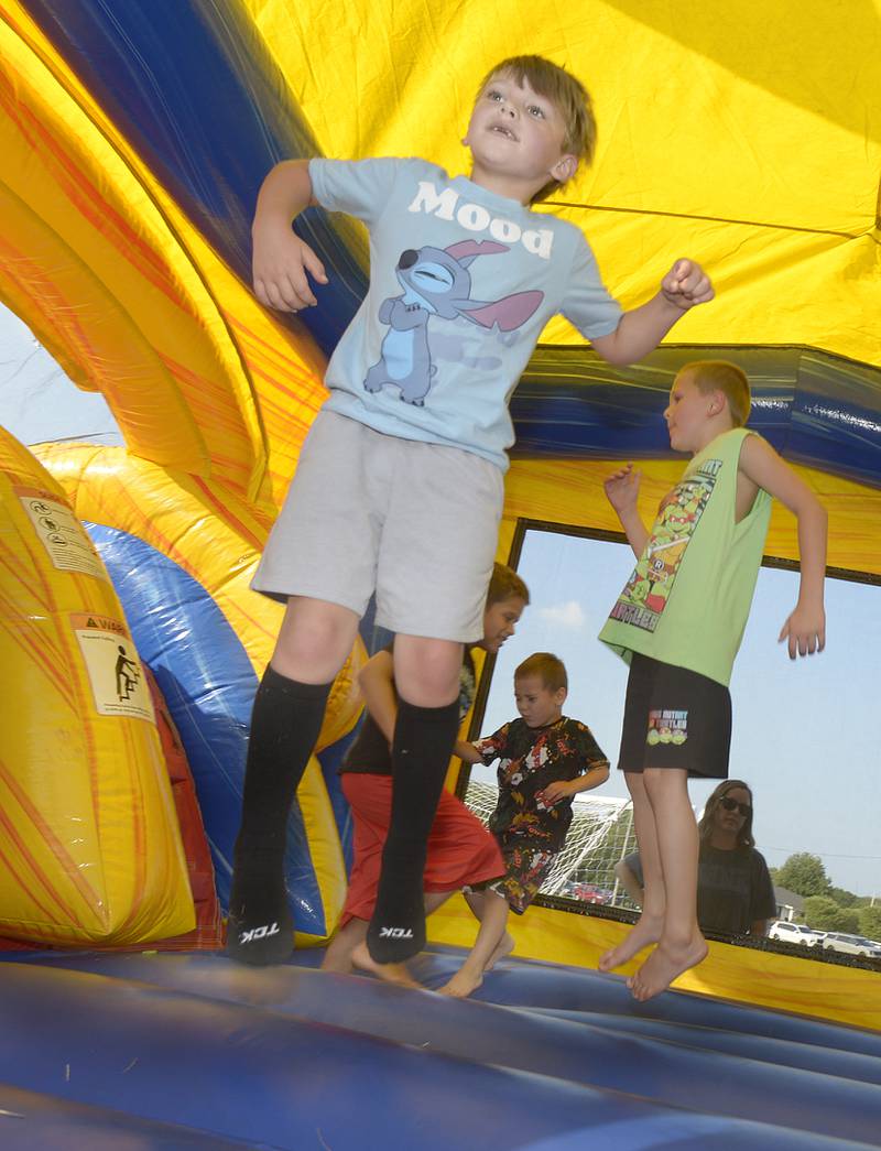 The feet were flying at two of the bounce houses Tuesday evening at Peck Park in Ottawa during National Night Out. Numerous games and family activities took place during the three hour event.