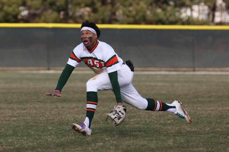 Plainfield East’s Christian Mitchelle chases down a fly ball against Downers Grove North. Friday, April 1, 2022, in Plainfield.