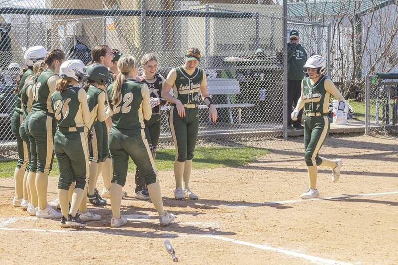St. Bede players cheer on Gabby Doyle after her home run during the St. Bede vs. Putnam County game on April 8, 2023 at St Bede Academy.