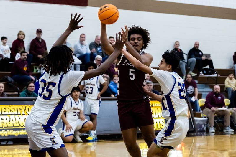 Lockport's Nathan Munson passes to a teammate during a WJOL Thanksgiving Classic Boys Basketball game against Joliet Central at the University of St. Francis’s Pat Sullivan Center in Joliet on Nov. 24, 2025.
