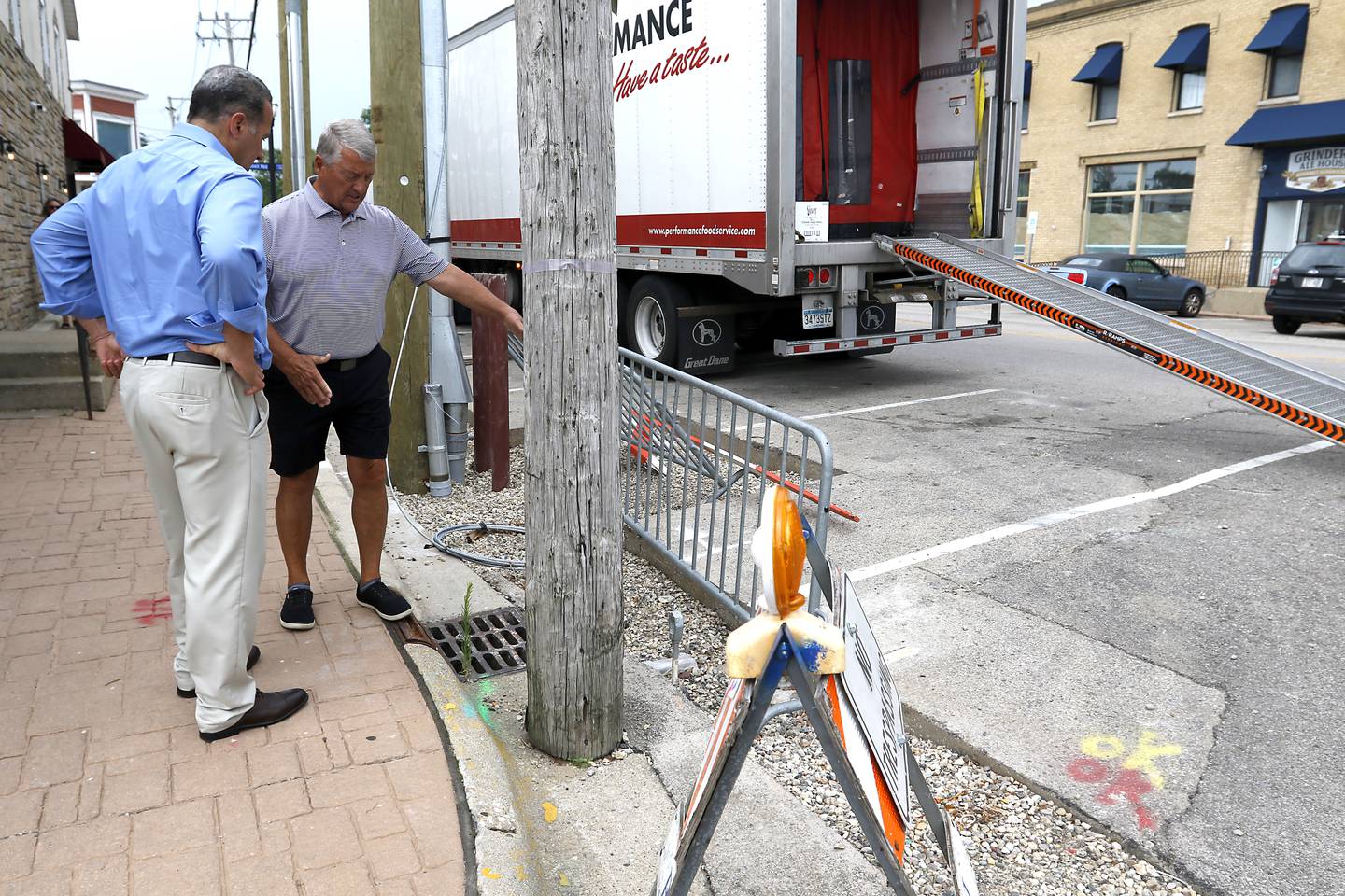 Bill Hobson, the director of Parks and Recreation at City of McHenry, discusses with John Smith, president of the Mchenry Riverwalk Foundation, work that still needs to be done along Pearl Street related to the McHenry Riverwalk in McHenry on Tuesday, July 24, 2024.
